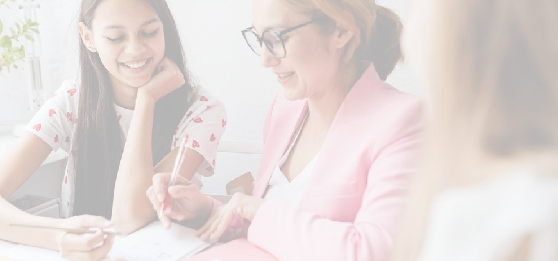 Teacher helping a teenage student prepare for the CILS B1 exam